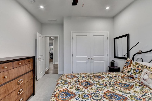 carpeted bedroom featuring recessed lighting, a closet, visible vents, a ceiling fan, and baseboards