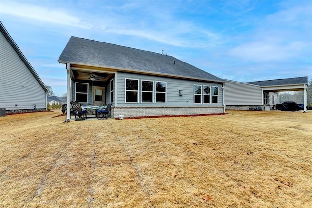 811 Pineberry Ct, Grayson, GA 30017 - back of house with ceiling fan, a yard, and a patio area