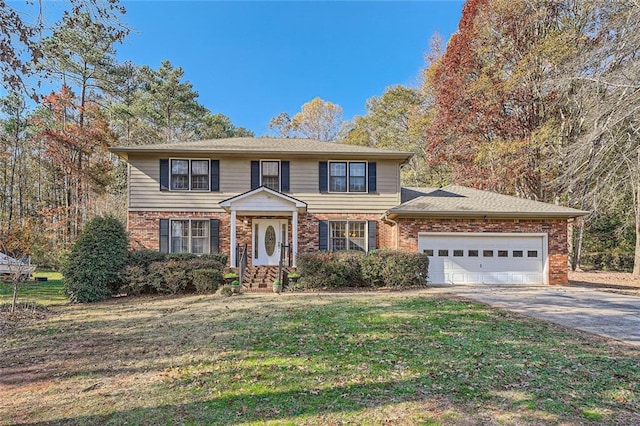 view of front of home with brick siding, an attached garage, driveway, and a front lawn