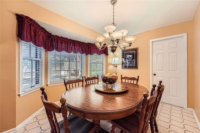 dining space featuring an inviting chandelier