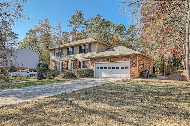 view of property featuring a garage and a front lawn