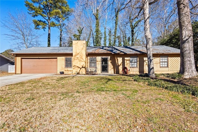 single story home with a front yard and a garage