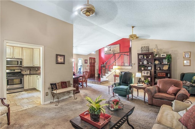 9760 Loblolly Ln, Roswell, GA 30075 - living room with a ceiling fan, stairs, vaulted ceiling, light colored carpet, and a textured ceiling
