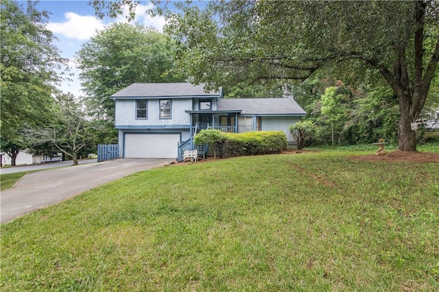 9760 Loblolly Ln, Roswell, GA 30075 - view of front of house with an attached garage, a front yard, and driveway