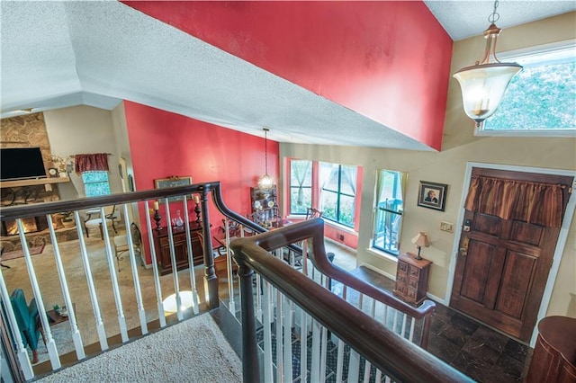 9760 Loblolly Ln, Roswell, GA 30075 - entryway with a textured ceiling, plenty of natural light, and lofted ceiling