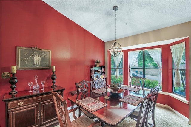 9760 Loblolly Ln, Roswell, GA 30075 - carpeted dining room with vaulted ceiling, a chandelier, a textured ceiling, and baseboards