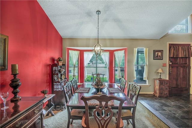 9760 Loblolly Ln, Roswell, GA 30075 - dining room with a textured ceiling, stone tile floors, and baseboards