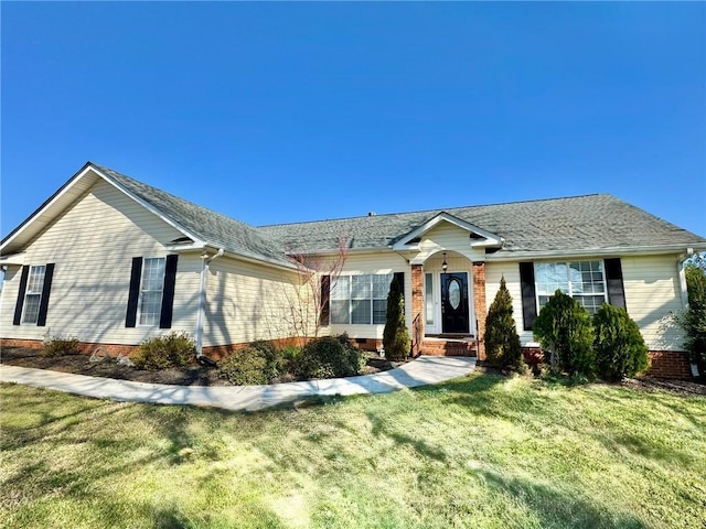 ranch-style house with crawl space, a front yard, and roof with shingles