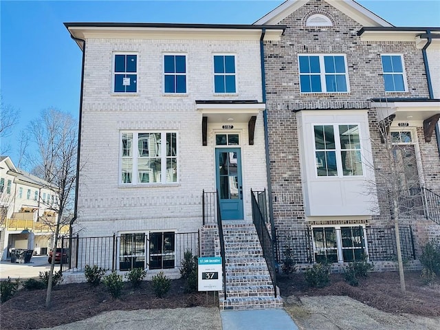 view of front of home with brick siding