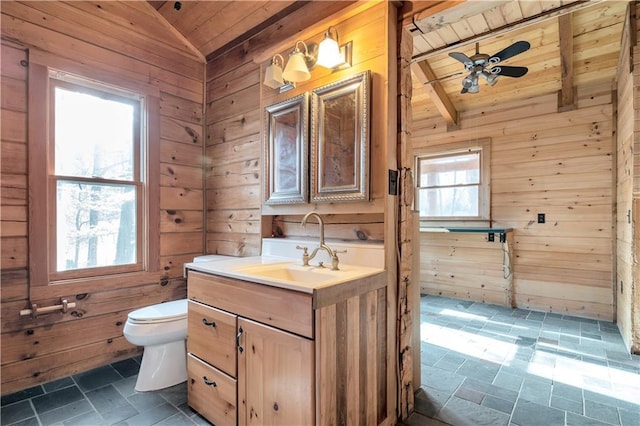 bathroom with tile flooring, ceiling fan, wooden ceiling, and lofted ceiling with beams