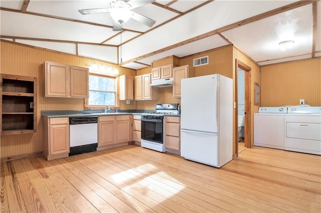 kitchen featuring light hardwood / wood-style floors, washing machine and dryer, ceiling fan, white appliances, and vaulted ceiling