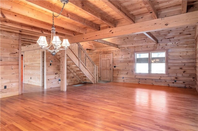 interior space featuring wooden walls and light hardwood / wood-style floors