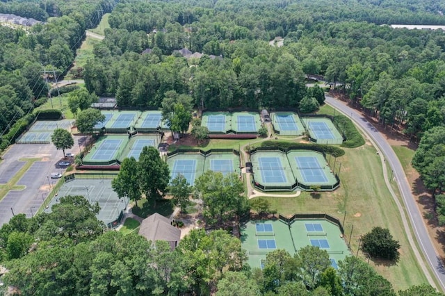 aerial view of property's location featuring a forest