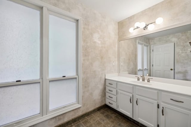 bathroom featuring vanity and baseboards