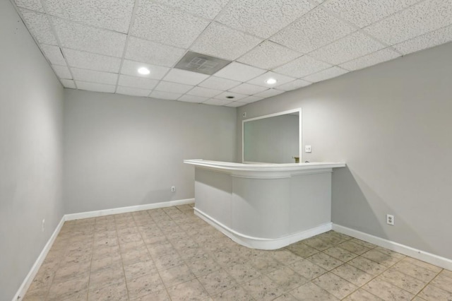 bar featuring recessed lighting, a drop ceiling, and baseboards