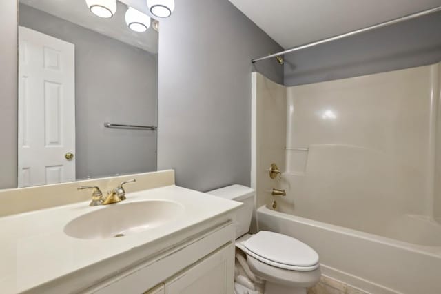 full bath featuring toilet, vanity, and shower / washtub combination