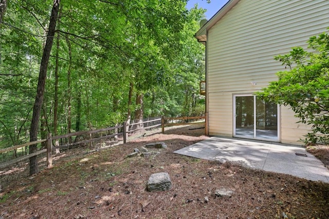fenced backyard featuring a patio