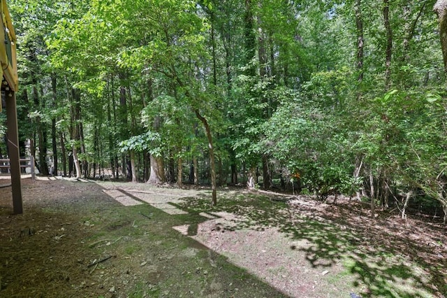 view of yard with a forest view