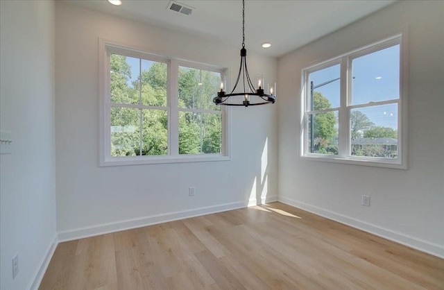 1919 Deco Dr, Kennesaw, GA 30144 - unfurnished dining area featuring plenty of natural light, a chandelier, light wood finished floors, and recessed lighting