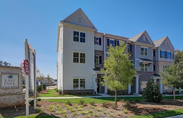 1919 Deco Dr, Kennesaw, GA 30144 - view of front of home with board and batten siding and brick siding