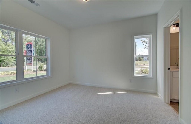 1919 Deco Dr, Kennesaw, GA 30144 - unfurnished room with healthy amount of natural light and light carpet