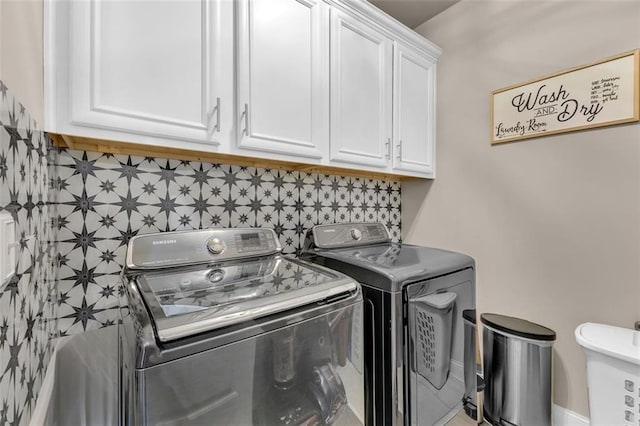 laundry area featuring cabinets and separate washer and dryer