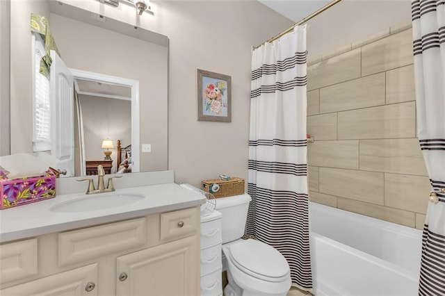 full bathroom with toilet, vanity, and shower / bathtub combination with curtain