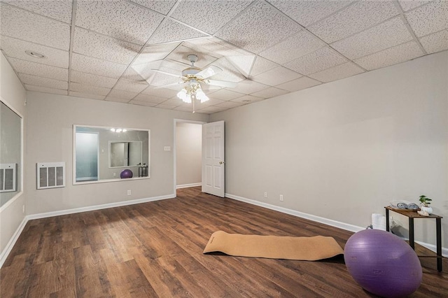 exercise area featuring a drop ceiling, wood finished floors, visible vents, and baseboards