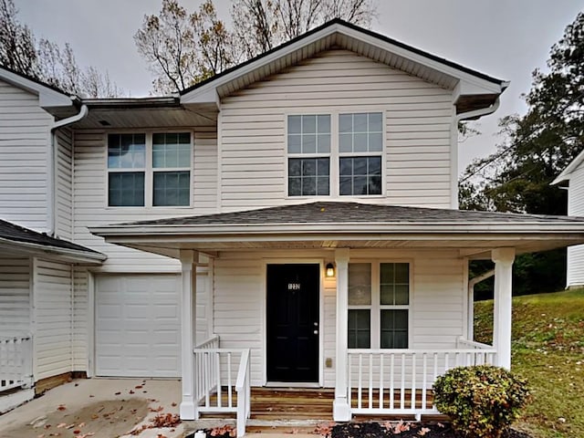 1232 Pinedale Cir NW, Conyers, GA 30012 - view of front facade with covered porch, an attached garage, and driveway