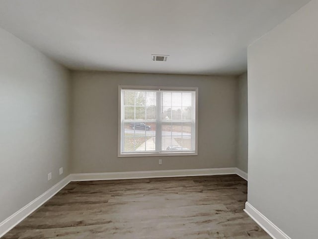 1232 Pinedale Cir NW, Conyers, GA 30012 - empty room featuring wood finished floors and baseboards