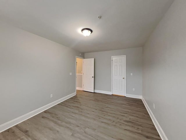 1232 Pinedale Cir NW, Conyers, GA 30012 - unfurnished bedroom featuring wood finished floors and baseboards