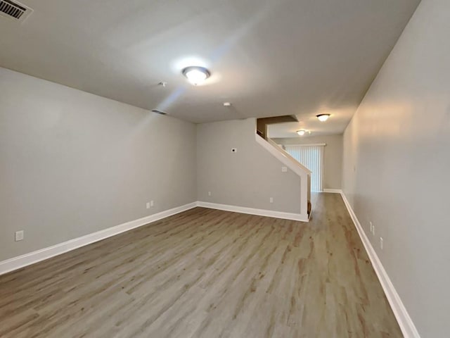 1232 Pinedale Cir NW, Conyers, GA 30012 - finished basement featuring wood finished floors, baseboards, and stairway