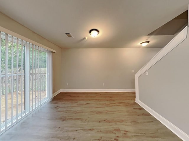 1232 Pinedale Cir NW, Conyers, GA 30012 - unfurnished room featuring baseboards and wood finished floors