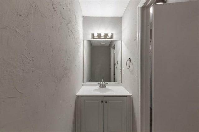 8541 Westchester Dr, Douglasville, GA 30134 - bathroom featuring a textured wall and vanity