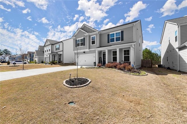 view of front of property with a porch and a garage