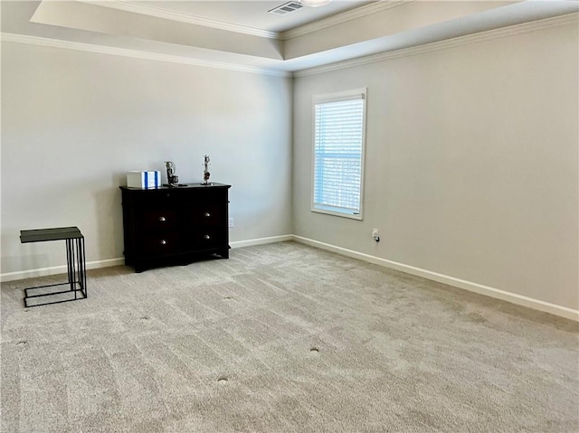 bedroom featuring a tray ceiling, carpet floors, baseboards, and ornamental molding