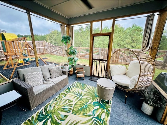 sunroom / solarium featuring a healthy amount of sunlight