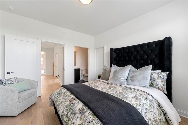 343 Concord St, Alpharetta, GA 30009 - bedroom with light wood-type flooring and baseboards