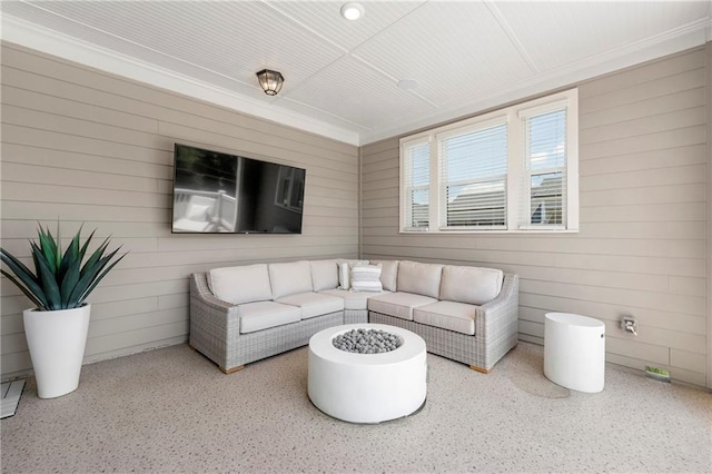 343 Concord St, Alpharetta, GA 30009 - living room featuring speckled floor, wood walls, and ornamental molding
