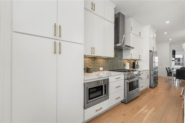 343 Concord St, Alpharetta, GA 30009 - kitchen featuring wall chimney exhaust hood, appliances with stainless steel finishes, light wood-type flooring, tasteful backsplash, and recessed lighting