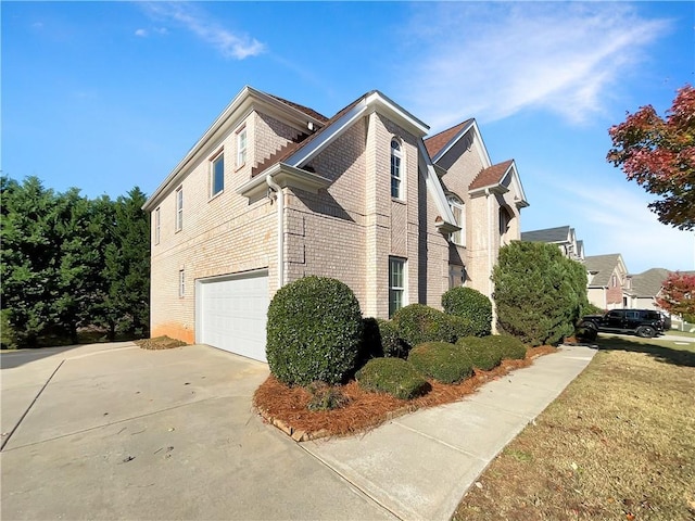 view of side of property with a garage