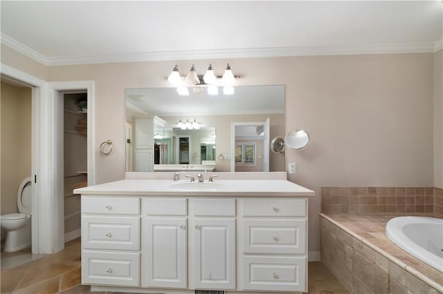 bathroom featuring tile patterned flooring, ornamental molding, a relaxing tiled tub, and vanity