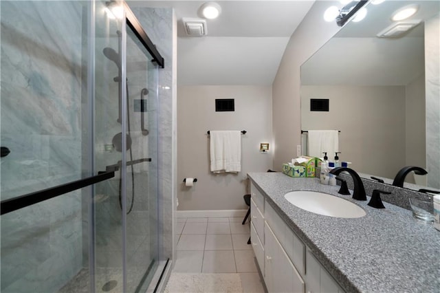 bathroom featuring tile patterned flooring, vanity, and an enclosed shower