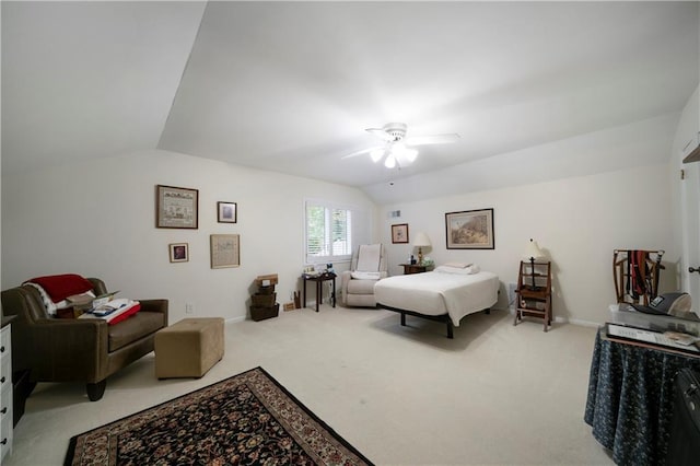 carpeted bedroom featuring lofted ceiling and ceiling fan