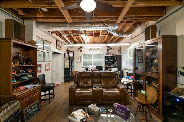 interior space featuring dark hardwood / wood-style floors, heating unit, and ceiling fan