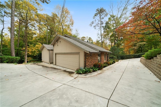 view of side of home with a garage