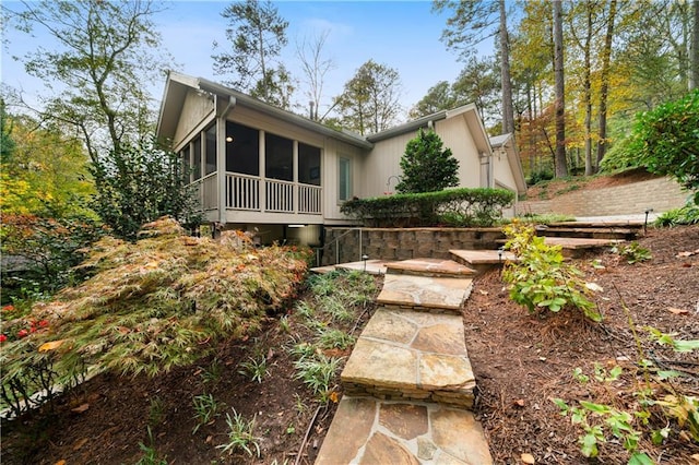 rear view of house with a sunroom