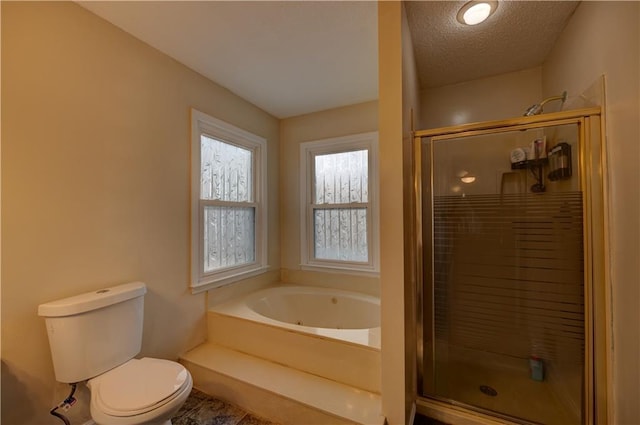 bathroom featuring a textured ceiling, plus walk in shower, and toilet