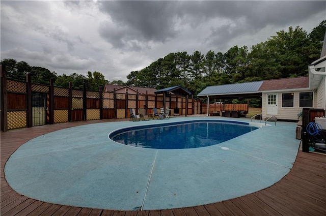 view of swimming pool featuring a deck