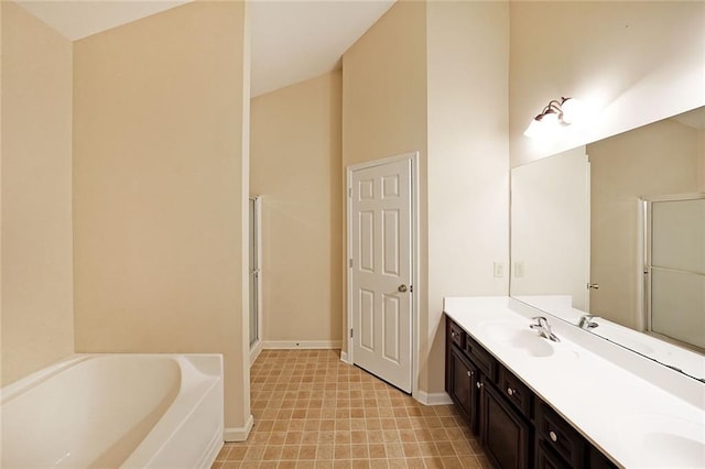 bathroom featuring vanity and a bath